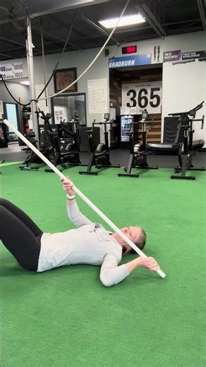 Shoulder external rotation stretch with stick for shoulder mobility