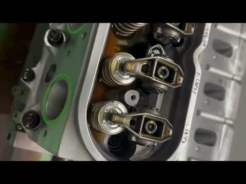 How the rocker arm operates inside the cylinder head of the engine 