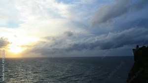 Time lapse sunset over Bali ocean at famous Sea Temple Uluwatu