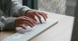 Woman type on desktop computer