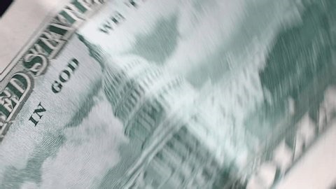 clip-3989627237-macro-spinning-united-states-passport-us-dollar