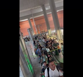 Crowded scene at Terminal 4 in Barajas Airport, Madrid, Spain