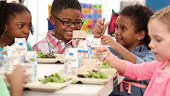 Kindergarteners eating in school cafeteria