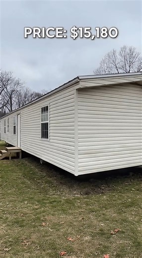 used manufactured home priced at $15,180. From the outside, it looks plain and outdated. But once inside, a few things feel different than expected. The flooring feels solid, the living space opens up more than it looks on camera, and the layout actually works for daily life. The kitchen is old but functional. The bathroom works with only a small fix needed. The bedroom feels quiet and stable — something you don’t expect at this price. This isn’t about looks. It’s about choosing ownership over r