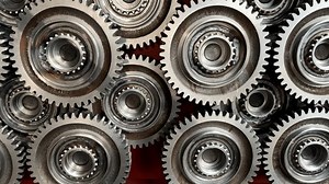 Gear, spare parts. Workshop of a automotive factory for production of automotive gear, spare parts. Production of gears for automobile gearboxes. Metal gears from threading machine on Assembly line