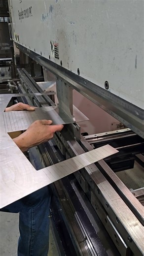 This titanium roll cage shroud is punched out then bend by bend formed. Other steps of fabrication occur before being placed on the dragster or funny car. | McKinney Corp