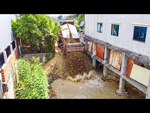 Start Opening New Project!Black dozer pushing Soil into Concrete space that holds water&5T​ ​Trucks​