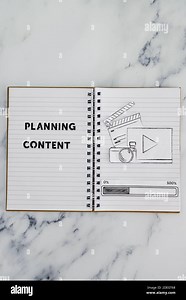 planning content for social media conceptual image, notebook with photo and video icon next to text and progress bar loading Stock Photo - Alamy