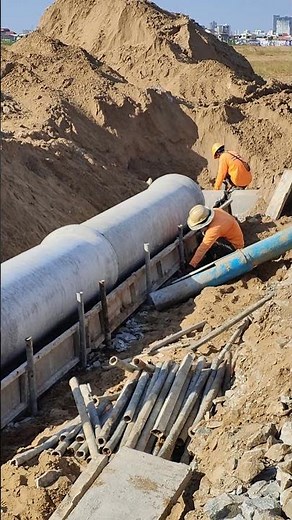 Civil Engineering Site Work: Setting Forms for Large Concrete Pipe Encasement
