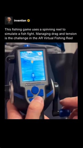 Invention on Instagram: "The AR Virtual Fishing Reel is a handheld electronic toy that combines a physical fishing reel with a built in screen. Players turn a real crank handle to reel in virtual fish while watching the action unfold on the display, creating a tactile experience closer to fishing than traditional button based games. Gameplay focuses on managing reel speed and tension. When a fish bites, resistance increases and pulling too hard can cause the line to fail, while reeling too slowl