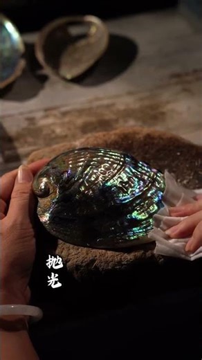 The shell pieces are stacked and inlaid to create a dazzling array of colors and the