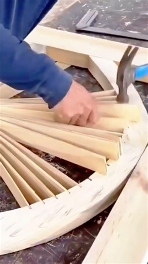 joining wood blocks with a white hammer tool to create a strong and precise carpentry connection