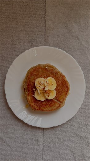 Oats Banana Pancakes………… Nutritional Information (per pancake): Calories: 250 kcal Protein: 6 g Carbohydrates: 50 g Fiber: 2 g Fat: 3 g ### Ingredients - 1 cup rolled oats - ½ cup semolina (sooji) - ⅓ cup milk - 1 tsp baking powder - ½ tsp baking soda - 2 tbsp curd (yogurt) - 2 ripe bananas - Ghee or oil – as needed for cooking - 2–3 chopped almonds - Honey – for drizzling ### Method - Grind the oats and semolina together into a fine powder. Transfer to a mixing bowl. - In a separate grinder, bl
