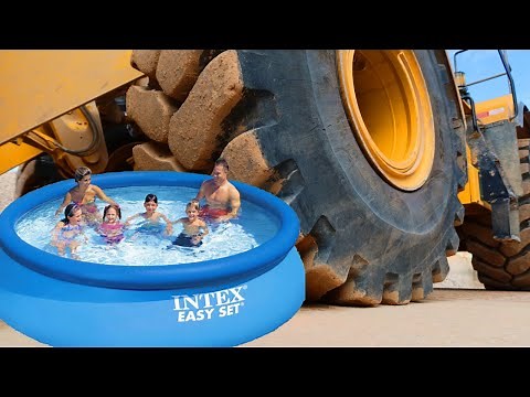 CRUSHING INFLATABLE POOL WITH GIANT TIRE! HUGE POP!