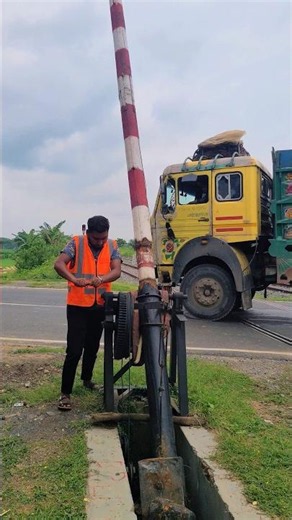 Operating the manual railway crossing gate, ensuring safety on the tracks. #shorts #gates #tracks