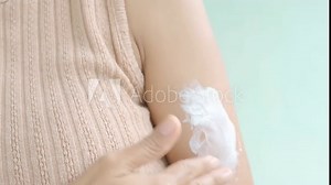 Woman apply lotion on hand, sunscreen Cream moisturizer cosmetic care beauty.
