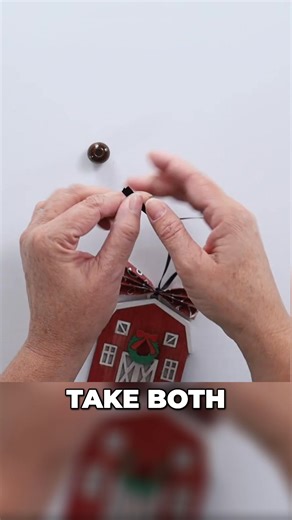 Transform a rectangle of paper into a charming ornament with this easy tutorial! Accordion fold, tie with ribbon, add a bead, and voila! A sweet, handmade touch for your tree. #DIYOrnament #PaperCraft #HolidayDecor #ChristmasCrafts #EasyCrafts https://thecraftyblogstalker.com/laser-cut-christmas-barn-ornament/ | The Crafty Blog Stalker | Facebook