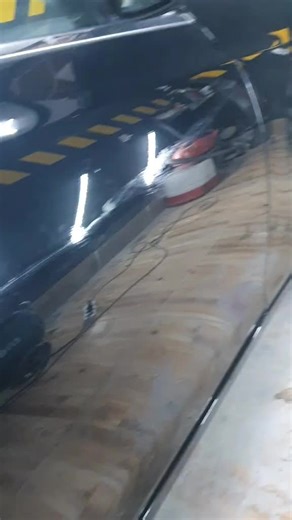 Exploring Reflective Car Features in a Garage Workshop