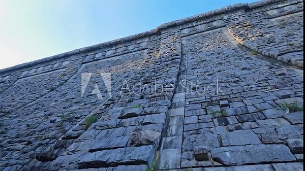 Massive stone wall of Kensico Dam, Valhalla, New York, USA. Extreme low angle view