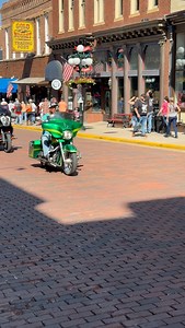 Neon green bike riding downtown Deadwood SD | ROXOR INFO