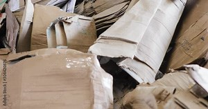 Large warehouse of waste paper in plant. Warehouse with recyclable materials at garbage processing factory. Huge pile of different paper pieces, rubbish, litter, trash, closeup view in motion.