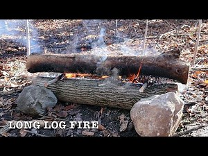 Building a long log fire - Winter camping Bushcraft