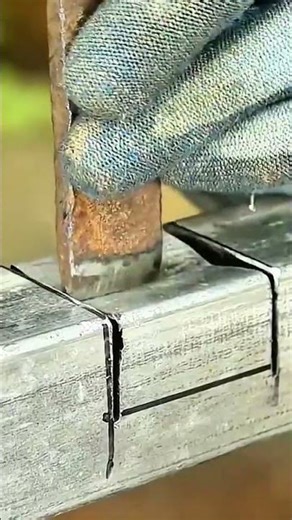 Gloved hand aligns metal joint—marker guides weld with steady craftsmanship