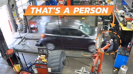 Mechanic Miraculously Survives Hit From Runaway Car Barreling Into Shop