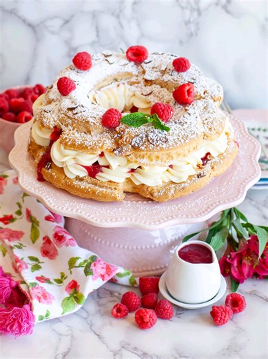 If you love raspberries and cream, you’re going to love this heavenly and impressive raspberry cream pastry dessert! Raspberry Paris-Brest is a light, fruity, and fluffy pastry that’s perfect for any occasion! It’s made with a pastry ring using pate-a-choux pastry dough; filled with fluffy whipped cream filling, tart raspberry sauce and loads of fresh raspberries. Every creamy, fruity bite simply melts in your mouth! Get all the recipe details and watch my full-length YouTube video tutorial on m