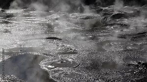 Geothermal mud pool at Rotorua, New Zealand. Rotorua's thermal mud is renowned as a skin care and beauty treatment. Boiling, bubbling steaming geothermal mud pool at Whakarewarewa Thermal Park.