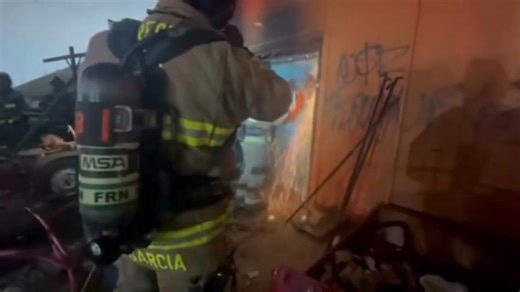 Firefighters had to cut through security bars and reinforced doors to rescue a man trapped inside a burning building on Sunday, November 9th, in Fresno's Chinatown. VIDEO: https://bit.ly/4oTtBdW (Photo: Fresno Fire Department) | FOX26