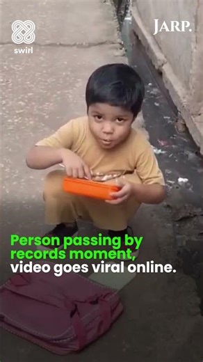 Young Boy Eats Noodles by Drain on Way to School | Viral Heartwarming Video