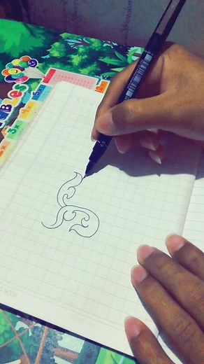 Artistic Hand Drawing Abstract Patterns on Notebook