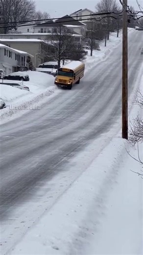 Snowstorm in the Poconos, PA – January 12, 2025. A standard school bus was caught on dashcam footage after it hit a patch of black ice on a steep mountain descent. The bus spins a full 180 degrees, sliding helplessly toward a utility pole. The driver attempted to steer, but the sheer weight of the bus on the ice made it impossible to recover. The impact with the pole finally stopped the drift. No passengers were on the vehicle at the time. This video is created using AI, and the story is for you