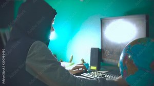 Hacker man programmer in the hood using computer laptop for hack information and data from user account. Stock Video