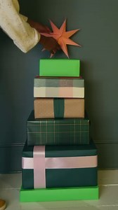 Try some a little ✨different✨ this year with a DIY gift box Christmas tree. We love this one we created by stacking wrapped boxes (we all have plenty of cardboard in our garage, right?!) and topping them with a paper star. Have you ever seen something so cute?! 🎄 #HGTVHowTo | HGTV