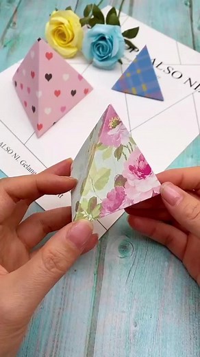 Children's creative handmade origami. Three-dimensional origami gift box