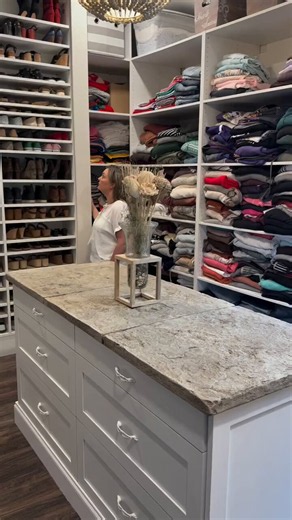 Okay but this woman’s closet is actually insane. Multiple huge racks packed floor to ceiling with shoes. Hundreds of pairs.