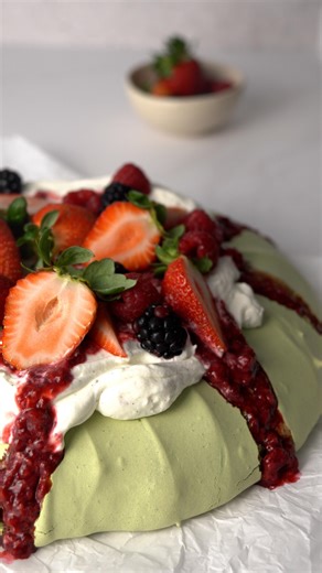 A beautiful, easy-to-make matcha pavlova for the holiday table. Perfect to share. Ingredients Matcha Meringue • 8 egg whites • 560 g powdered sugar • 12 g matcha powder • 30 g lime juice • 30 g cornstarch Whipped Cream • 250 g heavy cream, chilled • 30 g granulated sugar Topping • Fresh berries Instructions 1. Preheat the oven to 110°C (230°F). Line a baking tray with parchment paper and draw a 23 cm (9-inch) circle as a guide. 2. In a stand mixer fitted with a whisk attachment, whip the egg whi