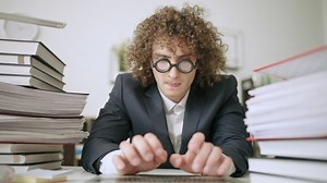 Funny man typing on laptop keyboard, nerdy office worker, too much work, pov