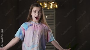 Excited girl shocked, excited, surprised and amazed opened mouth raise eyebrows, can't believe her eyes. Teen girl wonder with some news. Concept of expression. Stock Video