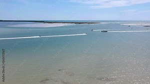 Island fun. This is part of a 21 clip collection of boats, island fly overs, wave runners, paddle boarders, canoes and more. Smooth buttery shots of sunny island adventures in Tampa Florida.