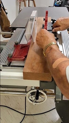 Shopsmith rip fence-mounted feather board.