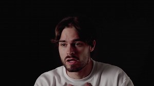 Trendy Young Man frightened gesture, scared expression, close, black background | Premium Stock Video Footage