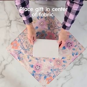Ditch the wrapping paper and learn to wrap your gifts with fabric this holiday season. Here's how: https://trib.al/ZaSI4U4 | Better Homes & Gardens
