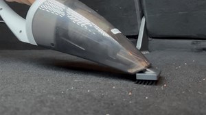 4K footage of a car vacuum cleaner removing dust and debris from carpeted car flooring. Perfect for auto detailing, car cleaning tutorials, and product demonstrations
