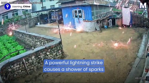 Dramatic lightning strike causes shower of sparks