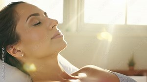 Woman relaxing with eyes closed during luxurious spa treatment