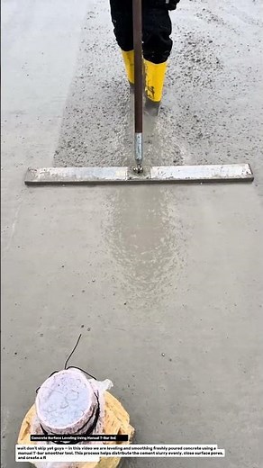 Concrete Surface Leveling Using Manual T-Bar Smoother.