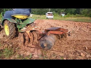 Brinly-Hardy disk Harrow on a garden tractor in.